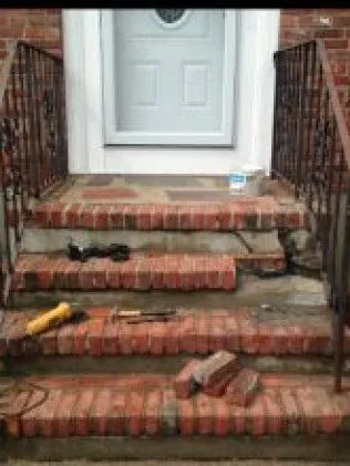Brick steps with construction tools and materials during home renovation project
